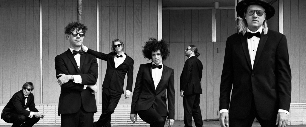 Arcade Fire Arcade Fire is a Canadian indie rock band, consisting of husband and wife Win Butler and Régine Chassagne, alongside Richard Reed Parry, Tim Kingsbury and Jeremy Gara. The band's current touring line-up also includes former core member Sarah Neufeld and multi-instrumentalists Paul Beaubrun, Dan Boeckner and Eric Heigle. Each of the band's studio albums features contributions from composer and violinist Owen Pallett. The band formerly featured Win's younger brother Will Butler, who departed in 2021 after eighteen years. Founded in 2001 by friends and classmates Butler and Josh Deu, the band came to prominence in 2004 with the release of their critically acclaimed debut album Funeral. Their second studio album, Neon Bible, won them the 2008 Meteor Music Award for Best International Album and the 2008 Juno Award for Alternative Album of the Year. Their third studio album, The Suburbs, was released in 2010 to critical acclaim and commercial success. It received many accolades, including the 2011 Grammy for Album of the Year, the 2011 Juno Award for Album of the Year and the 2011 Brit Award for Best International Album. From Wikipedia (https://en.wikipedia.org/wiki/Arcade_Fire) under Creative Commons Attribution CC-BY-SA 3.0 (http://creativecommons.org/licenses/by-sa/3.0/legalcode) alternative dance alternative rock baroque pop canadian indie Indie Pop Indie Rock modern rock new rave permanent wave quebec indie Rock stomp and holler