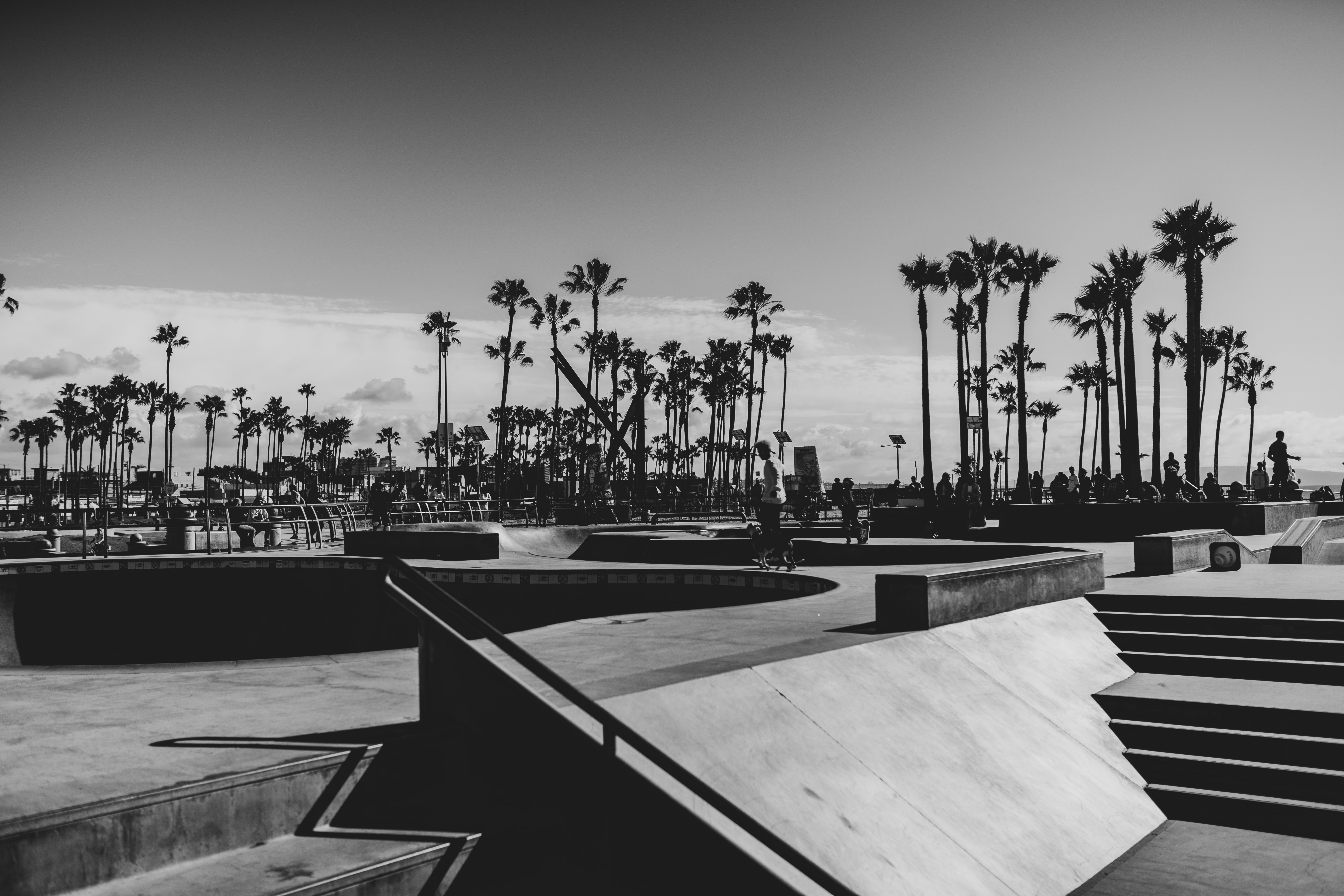 people playing basketball on basketball court in grayscale photography