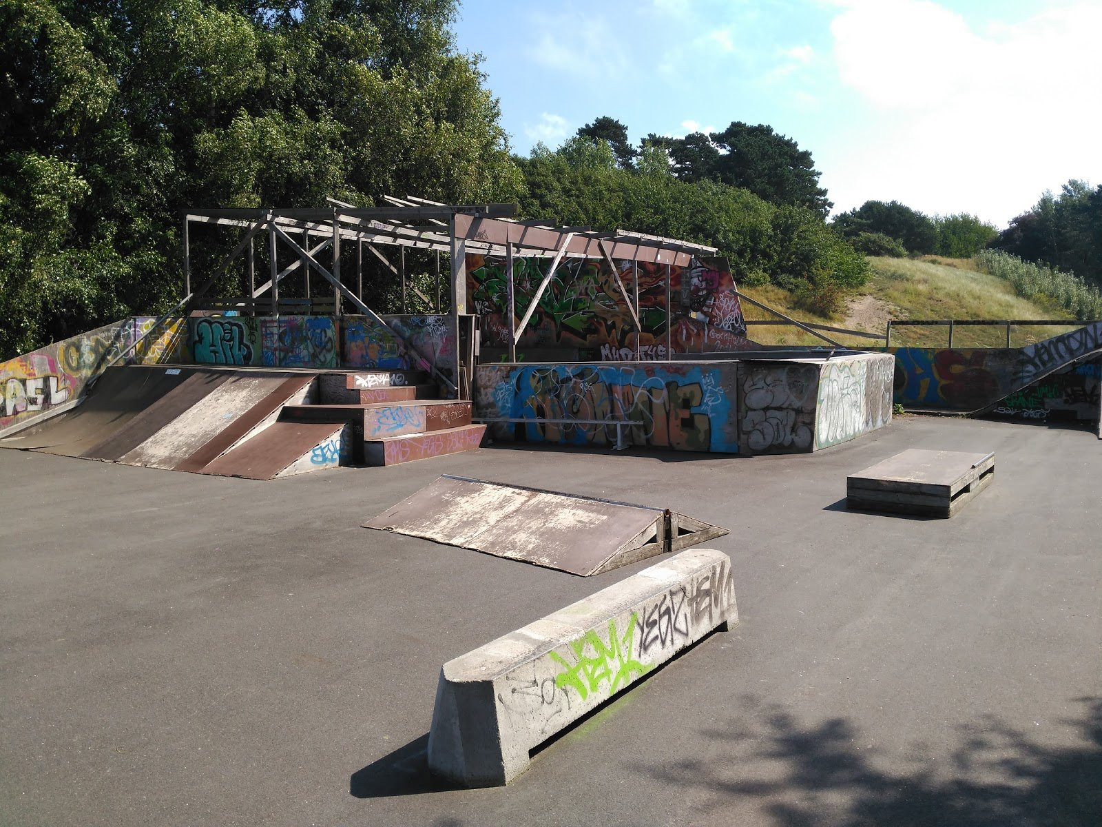 Rønne Skatepark is a good example of how private owners can build a skatepark which local people can use. The park is square and has everything a skater needs from a local skatepark.The park has quarter pipes, a mini vert, rails and grind boxes. The mini vert is a nice addition to the park because it’s height is so low that both beginners and more experienced skaters can use it. Most of the park is built of wood which means that some of the obstacles are a little worn, however most of them are maintained well. The park is perfect for local skaters and definitely worth a visit if you are travel to Bornholm.&nbsp;