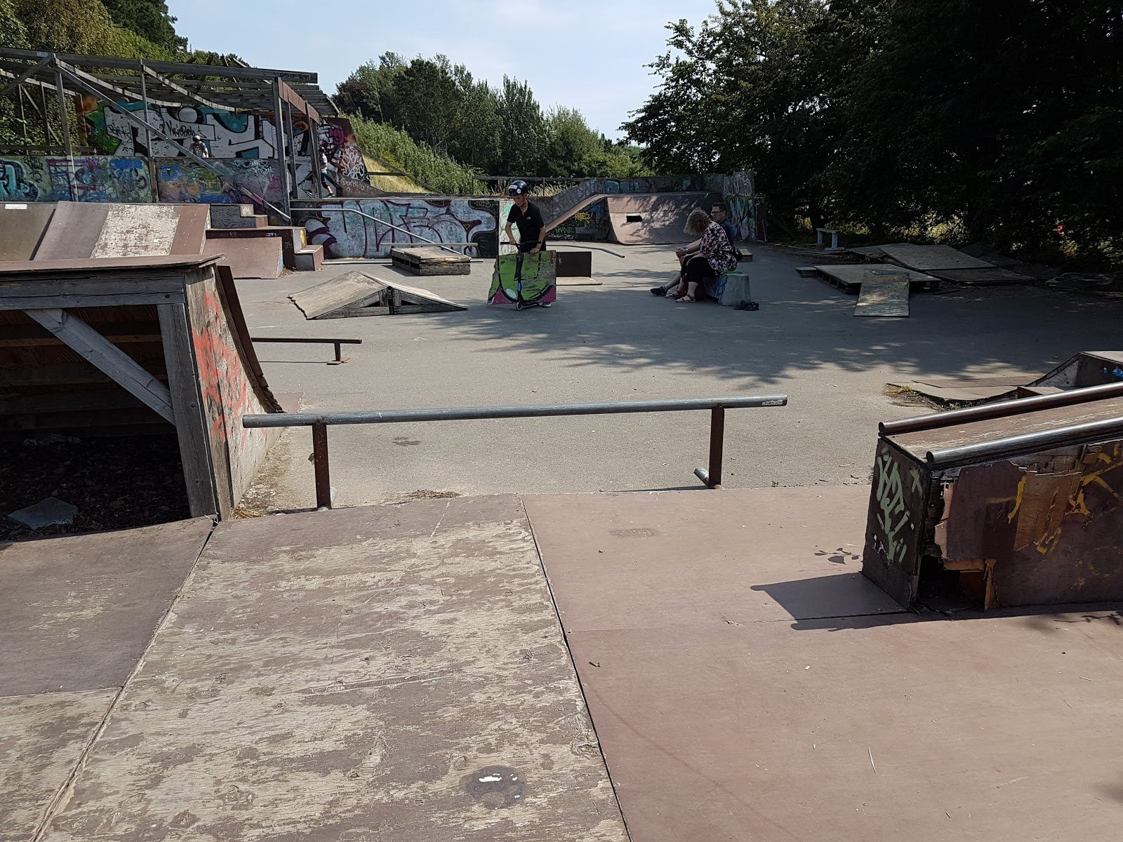Rønne Skatepark is a good example of how private owners can build a skatepark which local people can use. The park is square and has everything a skater needs from a local skatepark.The park has quarter pipes, a mini vert, rails and grind boxes. The mini vert is a nice addition to the park because it’s height is so low that both beginners and more experienced skaters can use it. Most of the park is built of wood which means that some of the obstacles are a little worn, however most of them are maintained well. The park is perfect for local skaters and definitely worth a visit if you are travel to Bornholm.&nbsp;