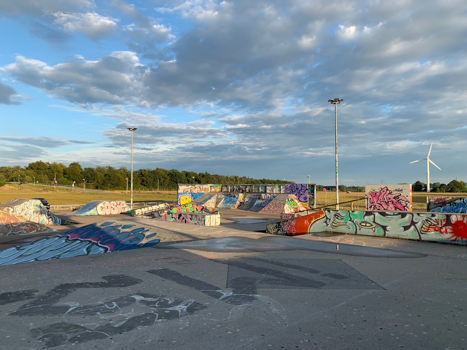 Darup Skatepark is situated on the moor close to Roskilde and it is a paradise for all skaters. The park has a large and satisfactory street course which combines spines, manual pads, ledges and rails in a unique way. Furthermore, a brand new bowl was built in 2012, replacing the old mini vert. The bowl is made of wood and steel and it is great for experienced skaters. As if this was not enough, Darup skatepark also has a large vert like the ones that are used for competitions with professional skaters. This means that whether you are a street skater, a vert skater or a bowl skater, there is something for you to enjoy in Darup. During the warm-up days at Roskilde Festival, Darup Skatepark is a popular haven for the skaters who participate in the festival. There are countless event for both skateboarders, rollerbladers and BMXers. In addition, there are usually many professional skaters from all over the world who participate in shows at this park during the Roskilde Festival. You do not want to miss this.