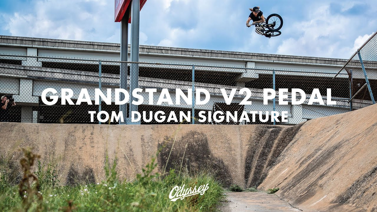 SHOP NOW: https://odysseybmx.com/grandstand<br /><br />Tommy Dugan sure knows how to ramp up the energy and put his signature Grandstand V2 pedals to good use. <br /><br />GRANDSTAND V2 PEDAL<br /><br />The Odyssey Grandstand v2 pedal has a redesigned internal configuration with an updated bushing system to reduce axial movement.<br /><br />Like the original Grandstand, it still features a unique slim profile, a wide platform and a comfortable concave that feels exceptional as soon as you set foot on it. The pedal features a unique bearing configuration that allows a big spindle to be paired with a slim pedal body.<br /><br />Available in PC and Alloy. <br /><br />FEATURES<br /><br />- Second version of the popular Grandstand pedal<br />- High strength plastic composite<br />- Redesigned internal configuration to reduce axial movement<br />- Proprietary 14mm heat-treated chromoly spindle with 17mm wrench flats and 6mm broach<br />- Extra large contact surface<br />- 8 oversized pins per side<br />- Genuinely thin body: 17mm at center with uninterrupted dual concave<br /> <br /><br /><br /><br /><br />---<br /> http://www.odysseybmx.com<br /> ---<br /> http://facebook.com/odysseybmx<br /> http://twitter.com/odysseybmx<br /> http://instagram.com/odysseybmx<br /> http://odysseybmx.tumblr.com<br /> http://youtube.com/odsyvision