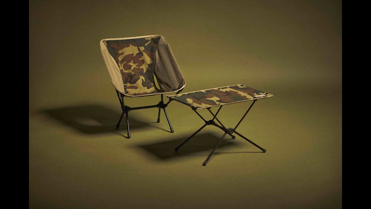 As part of its Spring/Summer 21 collection, Carhartt WIP has partnered with Helinox, the Korean brand known for its lightweight, portable camping furniture.<br />The resulting Valiant 4 Tactical Chair and Valiant 4 Tactical Table One both draw inspiration from garments within the collection, utilizing a four-color "laurel" camouflage print.<br />Both items are constructed from high-strength aluminium tubing, created by tent pole technology experts DAC, and can be quickly packed down and easily carried anywhere.<br /><br />Now available in stores, at selected retailers and online at carhartt-wip.com.<br /><br />More from Carhartt WIP<br />Official website: https://www.carhartt-wip.com/<br />Instagram: https://www.instagram.com/carharttwip/<br />Monthly Podcast: https://lnk.to/RelevantParties