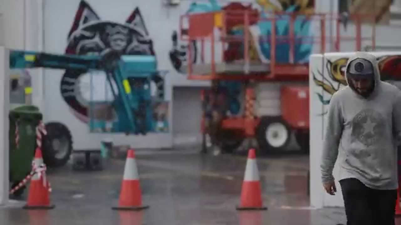 Australian street artists The Yok, Sheryo and Alex Lehours, with help the Australian community, collaborated to transform a site in Fremantle Australia with a fully democratic community mural. Via the hashtag #sneakerclashfreo hundreds of creative submissions were sent in from people across Australia with suggestions on what would appear on the wall, with the top 20 selected by the artists and brought to life on the streets with a burst of colour and creativity. The completed work remains as a permanent piece for the public to enjoy.