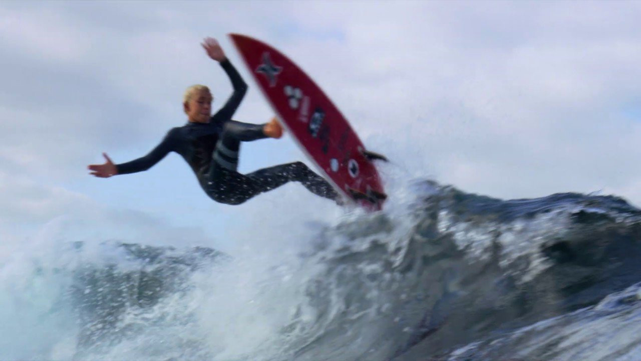 14-year-old Jarvis Earle and Julian Wilson share waves down the coast in Australia.