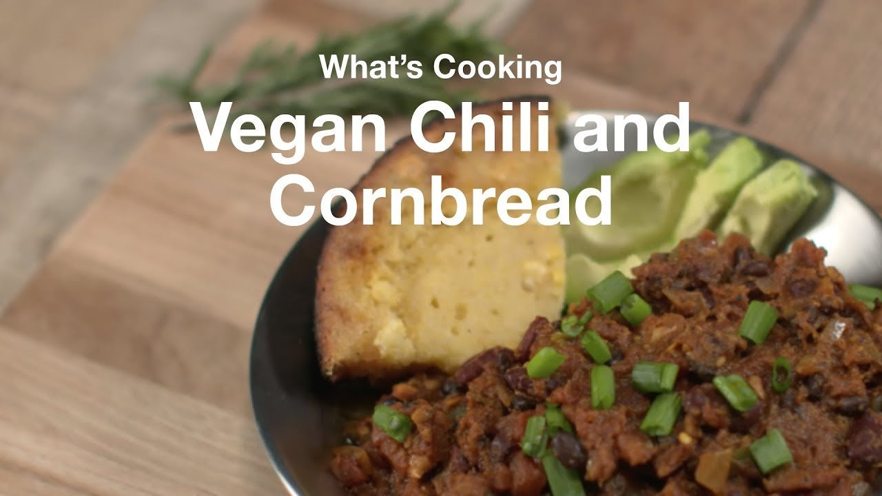 Learn how to make this camping staple in a not-so-traditional way.<br /><br />***<br /><br />16 Ingredients<br />15-Minute Prep<br />30-Minute Cook<br /><br />Ingredients:<br /><br />-Store-bought cornbread mix OR DIY mix.<br /><br />-3/4 Cup Unsweetened Almond milk<br /><br />-1/2 Cup Unsweetened apple sauce<br /><br />-1 Tbsp Apple Cider Vinegar<br /><br />For Chili:<br /><br />-Olive Oil<br /><br />-1 Green Pepper<br /><br />-1 Onion<br /><br />-2 Cans of tomatoes<br /><br />-1 can black beans<br /><br />-1 can kidney beans<br /><br />-2 Tbsp chile powder<br /><br />-1 Tbsp garlic powder<br /><br />-1 Tbsp red pepper flakes<br /><br />-1 Tbsp turmeric (optional)<br /><br />-1 avocado<br /><br />-1 green ionion<br /><br />Directions:<br /><br />Add olive oil to cast iron pan or dutch oven.<br /><br />Pour cornbread mix into bowl.<br /><br />Combine apple cider vinegar and almond milk in a bowl and let sit for a few minutes until it thickens.<br /><br />Add almond mixture to your cornbread dry mix, along with applesauce, and stir until smooth. If working with DIY recipe, mix in your olive oil and sweetener substitute now.<br /><br />Pour into hot cast iron and cover with tinfoil. Bake for about 20 minutes.<br /><br />For Chili:<br /><br />Dice 1 onion and 1/2 of a green pepper.<br /><br />Add olive oil to warm dutch oven or cast iron skillet.<br /><br />Add onion and green pepper and sauté until lightly browned.<br /><br />Add tomatoes (and optional green chiles – The Trader Joe’s canned tomatoes we used had diced green chiles)<br /><br />Add 1 can black beans and 1 can kidney beans, drained<br /><br />Add thin diced garbanzo beans (you can also pulse these in food processor ahead of time and store in ziplock bag).<br /><br />Add 2 tbsp chile powder, dash of cumin, paprika, turmeric, and as much garlic as you want.<br /><br />1 tsp salt and dash of black pepper<br /><br />Dice up green onion or chives.<br /><br />Cut open avocado and slice into sections<br /><br />Garnish chili with toppings and the cornbread.<br /><br />Drizzle honey on cornbread.<br /><br />Eat up!