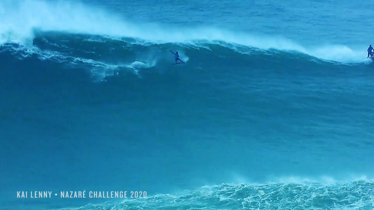 Shop 100 Foot Wave Gear at the store. Hats now $25! https://bigwavemerch.myshopify.com <br />Kai Lenny busts out a video-game-inspired 360 air on a huge Nazaré lefthander during the 2020 Tow Challenge -- and pays the price for innovation.