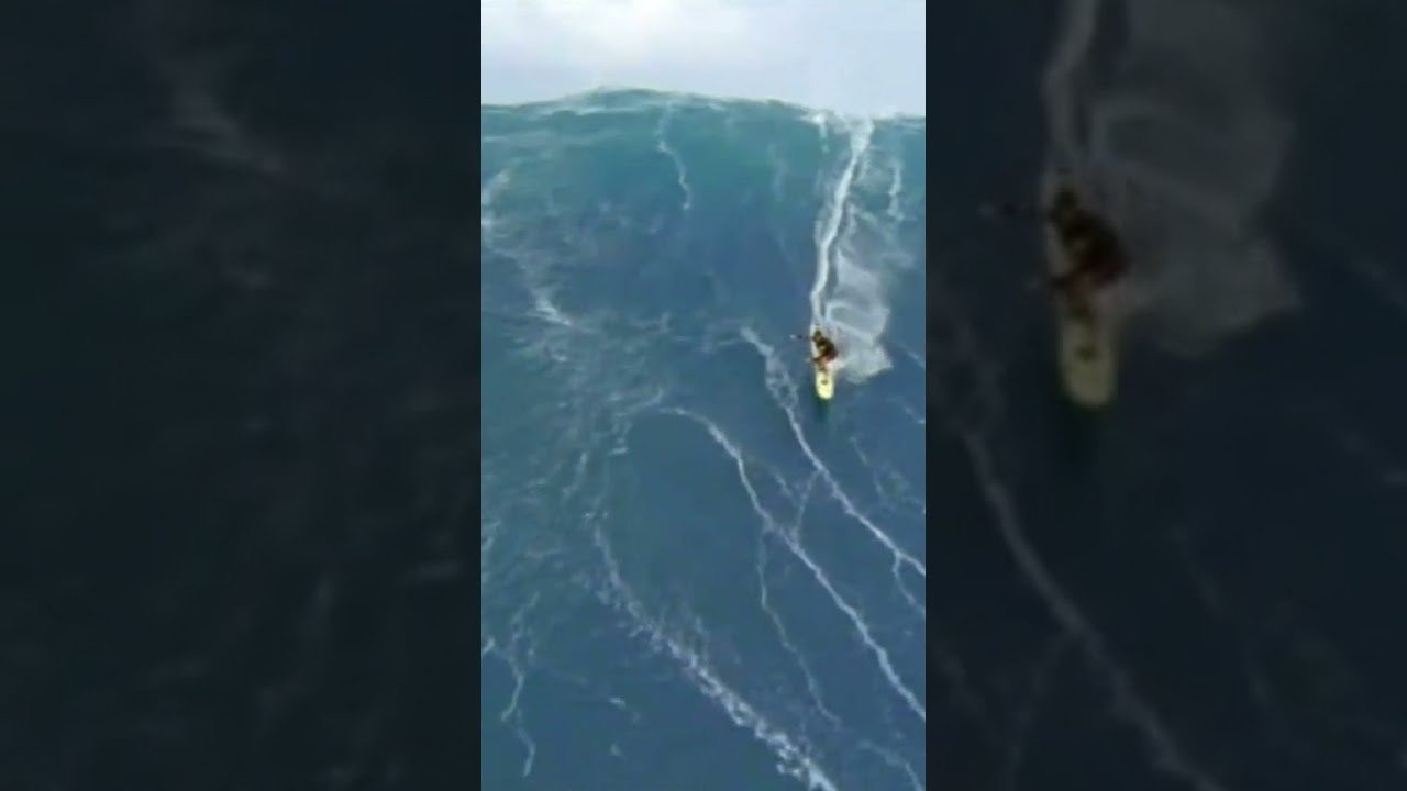 In one of the best big wave surfing moments ever captured, Mike Parsons gets towed into a massive wave at Jaws (Pe'ahi), Maui, Hawaii. Tow partner: Brad Gerlach. 35mm cinematography: Peter Fuszard. Helicopter pilot: Don Shearer. From the early days of the quest for the 100 foot wave. <br /><br />Check out the new gear at www.100FootWaveStore.com<br />#100footwave #cortesbank #bigwavesurfing #garrettMcNamara #bigwave #xxl #surfing #bigwavesurfing #nazare #jaws #waimeabay #mavericks #adventure #ocean #california #surf #wave