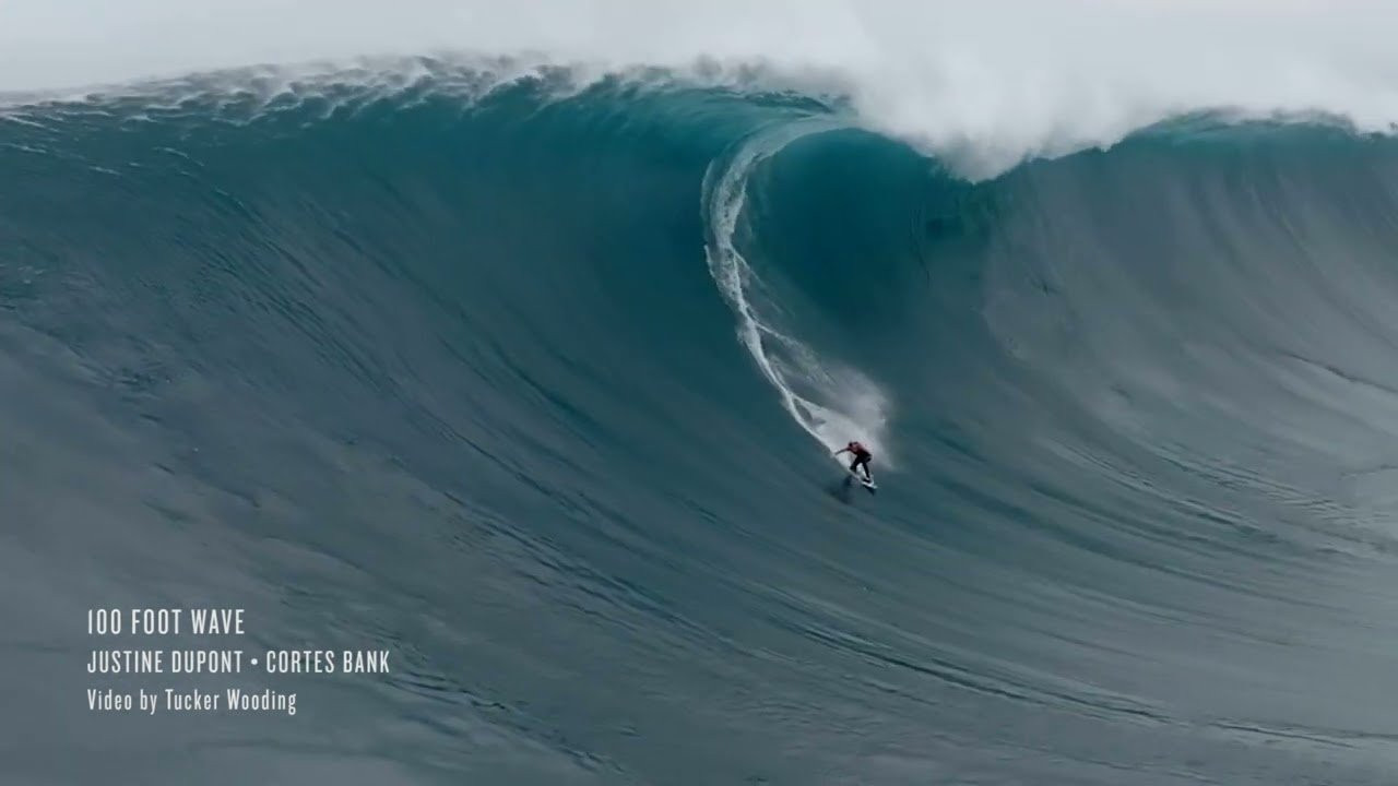 Justine Dupont of France rides one of the biggest waves ever challenged by a woman on January 13, 2023 at the Cortes Bank, 105 miles out in the Pacific Ocean southwest of Los Angeles, California. Footage from an upcoming episode of the HBO docuseries 100 Foot Wave. Drone video by Tucker Wooding. Shop the Big Wave Store at https://bigwavemerch.myshopify.com/