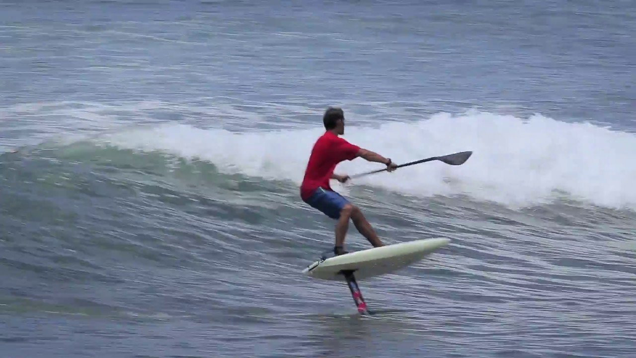 Austin Kalama completes an alley-oop on a SUP foilboard.