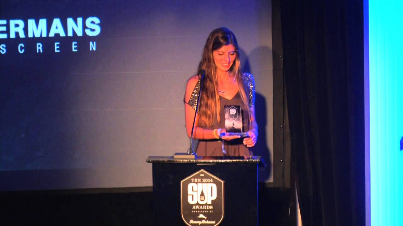 Annabel Anderson (3), Nicole Pacelli (2) and Izzi Gomez take the stage as the Top 3 Female Paddlers of the year at the 2014 SUP Awards. 