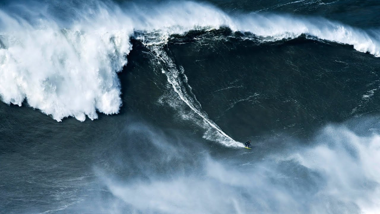 German big wave surfer Sebastian Steudtner surfed possibly the biggest wave ever on February 24, 2024, during the XXL swell at premier big-wave destination Nazaré, Portugal, this season.<br /><br />Steudtner surfed a monster wave that was measured at 28.57m (93.73ft), leveraging state-of-the-art drone technology developed by Porsche Engineering and Team Steudtner.<br /><br />The current world record, also held by Steudtner, is 26.21m (86.4ft), which was achieved at Nazaré in 2020.<br /><br />"I am very grateful to Porsche for the cooperative partnership over the past three years," says Sebastian Steudtner.<br /><br />"True to 'Driven by Dreams' and with Porsche as a partner, I have been able to fulfill my dream of contributing to the further development of my sport."<br /><br />During the XXL swell, the drone prototype from the joint technology project between Team Steudtner and Porsche Engineering was used.<br /><br />This project involves the development of a measuring drone that is intended to determine the height of waves quickly and precisely.<br /><br />Until now, video footage and still images have been analyzed for these types of measurements.<br /><br />The prototype from Porsche Engineering and Team Steudtner is equipped with cameras, control units and storage devices. In addition, sensors from vehicle development are used, which support modern driver assistance systems.<br /><br />The device can measure all areas of the wave and the surfer within a radius of about 100 meters.<br /><br />"We are very pleased to have created an innovative solution that can advance the sport of surfing. It was a challenge to develop a drone that can measure not only the height of the waves but is also capable of tracking the surfer within the radius throughout the entire wave ride," says Marcus Schmelz, Project Manager at Porsche Engineering.<br /><br />The official confirmation of new world records is the responsibility of official sports governing bodies.<br /><br />"We are open to sharing our technical insights from the drone development with official experts. Our goal is to further increase transparency in big wave surfing and to provide accurate measurement data more quickly,” Schmelz continues.<br /><br />Steudtner has based himself in Nazaré for the last few years as part of his “Mission Wave Alpha” project, which has seen him work with his partners Porsche, Porsche Engineering, Schaeffler, O2 Germany, Deutsche Vermögensberatung and X-BIONIC to take the sport to the next level on all fronts, from surfing the biggest waves to water safety, board materials & design.<br /><br />Deniz Keskin, Director of Brand Management and Partnerships at Porsche AG, adds:<br /><br />“Having mastered a potential highest world record wave on his new board, Caçador RS is a true pinnacle to three years of intensive cooperation with Sebastian. We are proud of our contribution and are delighted that our conviction to be an enabler rather than a pure sponsor has proven to be a great success.”<br /><br />Helping to surf the biggest waves possible, Steudtner developed surfboard technology in partnership with Porsche Engineering and Schaeffler to significantly optimize his surfboard over the past three years.<br /><br />Using the latest simulation methods and wind tunnel validations, the water and air resistances were successfully reduced.<br /><br />As a result, with the new board "Caçador RS," Steudtner can now reach speeds of up to 100 km/h, compared to the previous 80 km/h.<br /><br />The higher speed is necessary to ride larger waves – because the taller a wave is, the faster the surfer must be so that it doesn't overrun him.<br /><br />It was this advantage in speed that now enabled Steudtner to ride the potential next record wave.<br /><br />"Big wave surfing is a beautiful sport; I love it, and I am very proud to be able to bring it to the next level through the development of safety and technology and believing in my dream. It is my goal to improve big wave surfing and take it to the next level. Together with my team, which is driven by its unique 'can do' mindset to define what is possible in big-wave surfing, we were able to accomplish this mission,” emphasizes Sebastian Steudtner.<br /><br />Following the end of this season, Sebastian and his partners are now looking beyond Nazaré to explore new horizons focused on progressing big-wave surfing and ocean exploration.