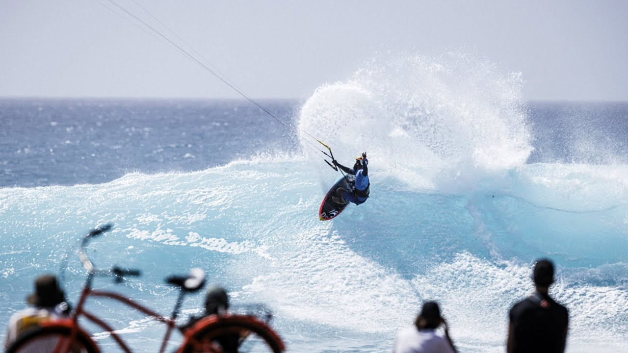 The inaugural event of the 2024 Qatar Airways GKA Kite World Tour marked the beginning of the kitesurfing season with the first World Cup.<br /><br />Ponta Preta on Cape Verde's Island of Sal hosted 37 top kitesurfers from 16 countries, showcasing their skills on the renowned waves.<br /><br />Airton Cozzolino, the reigning Kite-Surf World Champion from Italy, continued his impressive form in the men's competition. Cozzolino dominated the final, securing significant scores, including a 9.10 and an 8.53.<br /><br />Competing against his friend and mentor Mitu Monteiro from Cape Verde, both riders showcased their prowess on epic waves.<br /><br />Despite a strong effort, Monteiro couldn't match Cozzolino's high scores and settled for second place. The battle for the third podium spot was intense between Brazilians Pedro Matos and Gabriel Benetton, with Matos clinching third place with an 8.30 wave score, just 0.07 points ahead of Benetton.<br /><br />In the women's competition, Moona Whyte, the reigning Kite-Surf World Champion from the USA, dominated the final.<br /><br />Whyte secured the win with two flawless 10-point rides in optimal conditions. Her opponent in the final, Capucine Delannoy from Italy, put up a strong fight, but Whyte's perfect rides in the final set of waves secured her first place, leaving Delannoy in second.<br /><br />The mini-final between Charlotte Carpentier from France and Camille Losserand from Switzerland was highly competitive, with both athletes closely matched on the scoreboard.<br /><br />Losserand's final wave gave her a slight edge, securing third place on the podium by a fraction of a point.<br /><br />GKA Kite-Surf World Cup Cape Verde 2024 | Results<br /><br />Men<br /><br />1. Airton Cozzolino (ITA)<br />2. Mitu Monteiro (CPV)<br />3. Pedro Matos (BRA)<br /><br />Women<br /><br />1. Moona Whyte (USA)<br />2. Capucine Delannoy (FRA)<br />3. Camille Losserand (SUI)
