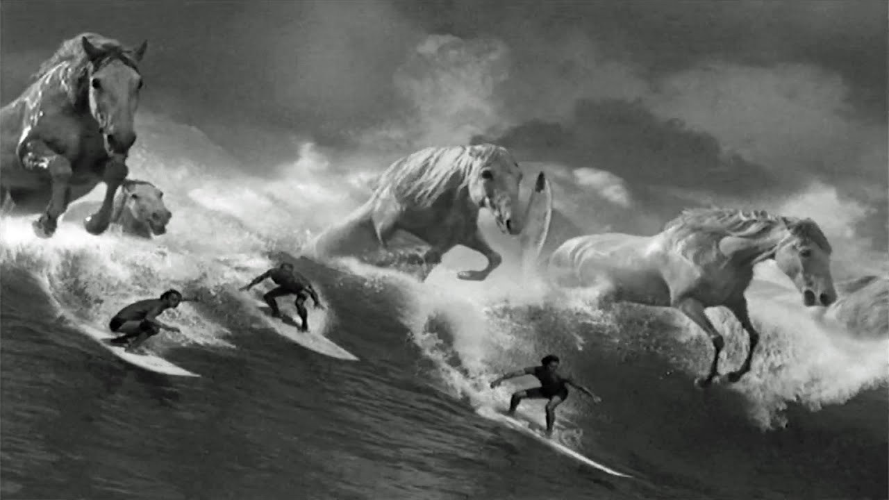 In 1999, director Jonathan Glazer and Abbott Mead Vickers BBDO (London) collaborated to create an extraordinary surfing commercial for Diageo, the multinational owner of Guinness.<br /><br />Known as "Surfer," this 60-second TV ad tells the tale of a Polynesian surfer conquering a massive wave under unique circumstances, turning it into a poetic, metaphysical, mythological, and philosophical experience.<br /><br />The commercial, shot over nine days in Hawaii, gained international acclaim and numerous awards. It was even hailed by Channel 4, The Sunday Times, and The Savory as the best ad ever.<br /><br />Inspired by Walter Crane's 1893 painting "Neptune's Horses," the monochrome ad also drew influence from the 1998 commercial "Swim Black" and Herman Melville's "Moby Dick."<br /><br />The voiceover, done by Scottish actor Louis Mellis, was guided by the style of poet Seamus Heaney.<br /><br />The soundtrack, composed by Leftfield, became part of the song "Phat Planet" in the band's album "Rhythm and Stealth" (1999).<br /><br />"Surfer" features Hawaii's Brian and Russ "Rusty" Keaulana, sons of legendary waterman Richard "Buffalo" Keaulana.<br /><br />The ad metaphorically symbolizes patience in waiting for the perfect wave and the Guinness two-part pour process, challenging the perception of Guinness as an "old man's drink."<br /><br />The production involved meticulous details, including addressing challenges like filming horses on a blue screen and choosing the right breed for jumps.<br /><br />The lead surfer, Chadwick "Dino" Lanakila Ching, was a local amateur discovered on the beach.<br /><br />The shooting in heavy waters, featuring massive waves and hanging cameramen off speedboats, presented significant challenges.<br /><br />The commercial's black-and-white tones highlighted the Guinness characteristics, while VFX by The Computer Film Company added surfing horses to Hawaiian waves.<br /><br />The choice of Leftfield's "Phat Planet" for the soundtrack, sounding "underwater," was made after considering around 2,000 tracks.<br /><br />Despite initial disappointing research results, the ad was launched on St. Patrick's Day in 1999, leading to remarkable success.<br /><br />It sold an additional Olympic swimming pool of Guinness every month and won the Gold Lion at the 1999 Cannes Lions International Film Festival.<br /><br />The 2005 "The Work of Director Jonathan Glazer" DVD includes an extended 90-second version of the iconic TV commercial.<br /><br />Guinness "Surfer" (1999) | Credits<br /><br />Client: Diageo/Guinness<br /><br />Director: Jonathan Glazer<br />Editor: Sam Sneade<br />Producer: Nick Morris<br />Production Manager: Patrick Duguid<br />Production Company: Academy Films<br />Advertising Agency: Abbott Mead Vickers BBDO<br />Agency Creative: Walter Campbell<br />Agency Creative / Copywriter: Tom Carty<br />Agency Producer: Yvonne Chalkley<br />Account Executive: Gavin Thompson<br />Creative Director: David Abbott<br />Art Director: Walter Campbell<br />Directors of Photography: Ivan Bird, Don King (water), Lee Allison (aerial)<br />Production Designer: Ben Myhill<br />Sound Design / Music Production Company: Wave Studios, London<br />Sound Designer: Johnnie Burn<br />Horse Supplier and Trainer: Tony Smart<br /><br />VFX: The Computer Film Company (CFC)<br />VFX Producer: Rachael Penfold<br />VFX Designer/Supervisor: Paddy Eason and Abbott Mead Vickers<br />CGI Supervisor: Dominic Parker<br />VFX Designer: Adrian de Wet<br />CGI Animator: Richard Clarke<br />Digital Paint and Animation: Gavin Toomey, Alex Payman, and Joe Pavlo<br />VFX Designer and Colorist: Tom Debenham<br /><br />Actors: Chadwick "Dino" Lanakila Ching, Brian Keaulana and Russ "Rusty" Keaulana<br /><br />Full Story:<br />https://www.surfertoday.com/surfing/one-of-the-most-exciting-surfing-ads<br /><br />Subscribe to SurferToday on YouTube<br />🔔 http://bit.ly/2TSO2be<br /><br />Online Surf Shop<br />🏄🏻‍♂️ https://bit.ly/online-surf-shop