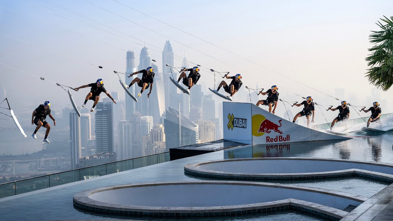 American wakeskating pioneer and three-time world champion Brian Grubb embraced a unique stunt.<br /><br />The project, named "WakeBASE," involved a unique combination of drone wakeskating and BASE jumping.<br /><br />The setting for this feat was at the Address Beach Resort in Dubai, featuring a Guinness World Record-holding infinity pool situated 294 meters above sea level.<br /><br />Grubb's challenge began with him wakeskating 94 meters across the rooftop pool, towed by a specially engineered drone.<br /><br />The stunt culminated with Grubb executing a BASE jump from the pool's edge, descending 77 stories before landing successfully on the beach below.<br /><br />This accomplishment was a realization of Grubb's seven-year dream and marked a historic milestone in extreme sports.<br /><br />To prepare for "WakeBASE," Grubb underwent rigorous training with BASE jump legend Miles Daisher.<br /><br />Despite having only 26 BASE jumps to his name by December 2022, Grubb completed 106 jumps during his training, which took place in Idaho, USA, and Lauterbrunnen, Switzerland, a renowned BASE jump location.<br /><br />The project also involved a partnership with Prada, which provided custom performance gear optimized for the requirements of both wakeskating and BASE jumping.<br /><br />The drone used in this stunt was custom-developed by a team led by Sebastian Stare, incorporating specialized hardware and software tailored for the demands of "WakeBASE."<br /><br />The choice of the Address Beach Resort in Dubai was strategic, as its high infinity pool and architectural layout were ideal for both the wakeskate run and the BASE jump.<br /><br />Full Story:<br />https://www.surfertoday.com/wakeboarding/brian-grubb-completes-wakebase-jump-off-dubai-infinity-pool<br /><br />Subscribe to SurferToday on YouTube<br />🔔 http://bit.ly/2TSO2be<br /><br />Online Surf Shop<br />🏄🏻‍♂️ https://bit.ly/online-surf-shop
