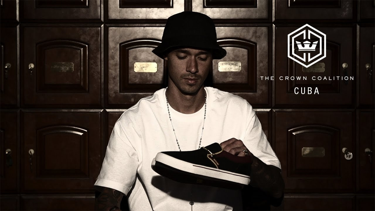 From beyond the shadows emerges the new limited edition Crown Coalition Cuba. Cloaked in expansive black suede and canvas, this low top slip-on features regal accents courtesy of the tongue's gold laurel leaf binding, a metallic gold chain, and custom Crown Coalition insignia on the insole. The shoe is couched upon a burgundy vulcanized sole with white foxing and a burgundy pinstripe. The Crown Coalition Cuba will be available for a limited time exclusively at Crown Coalition dealers. To learn more about the Crown Coalition or to find a dealer near you, visit http://www.suprafootwear.com.<br /><br />SITE: http://www.suprafootwear.com<br />FACEBOOK: http://www.facebook.com/suprafootwear<br />TWITTER: http://www.twitter.com/suprafootwear<br />INSTAGRAM: http://instagram.com/suprafootwear<br />PINTEREST: http://www.pinterest.com/suprafootwear<br />TUMBLR: http://www.suprafootwear.tumblr.com/<br />VIMEO: http://www.vimeo.com/suprafootwear