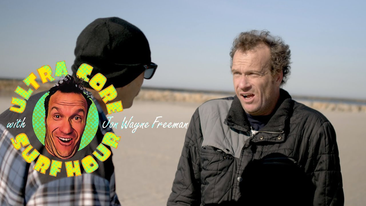 "In surfing, the vibe is everything," says Jon Wayne Freeman, in the season finale of "Ultra-Core Surf Hour" (above). "And one of the places where you'll find some of the worst, darkest vibes in the world are in the parking lot before you even hit the water. You'll see older guys staring at ya, you'll younger guys vibing you. Well guess what? I'm tired of it."<br /><br />In the newest episode of "UCSH", Jon gets fed up with the bad vibes that seem to permeate certain lineups in and around Southern California. "The grumpy, mean, scary-vibe locals -- I don't want to be apart of that scene anymore," Jon explains. "After all, we're just men in skin-tight suits, dancing for each other in the water, performing... It's time for the dawn of a new era -- a kook-friendly era. Let's help bring the change."<br /><br />As you'll see when you click play above, Jon tries to "bring the change" and banish eggy vibes in SoCal surf culture by killing people with kindness at his local surf spots. He offers other surfers free wax, creepily asks people if they need help applying their sunscreen up and hands out a superfluous amount of high fives and compliments in the water. But does Jon's strategy work? Does our humble host single-handedly change the face of surf cultureraise the stoke in lineups at large? Does he change the face of surf culture a