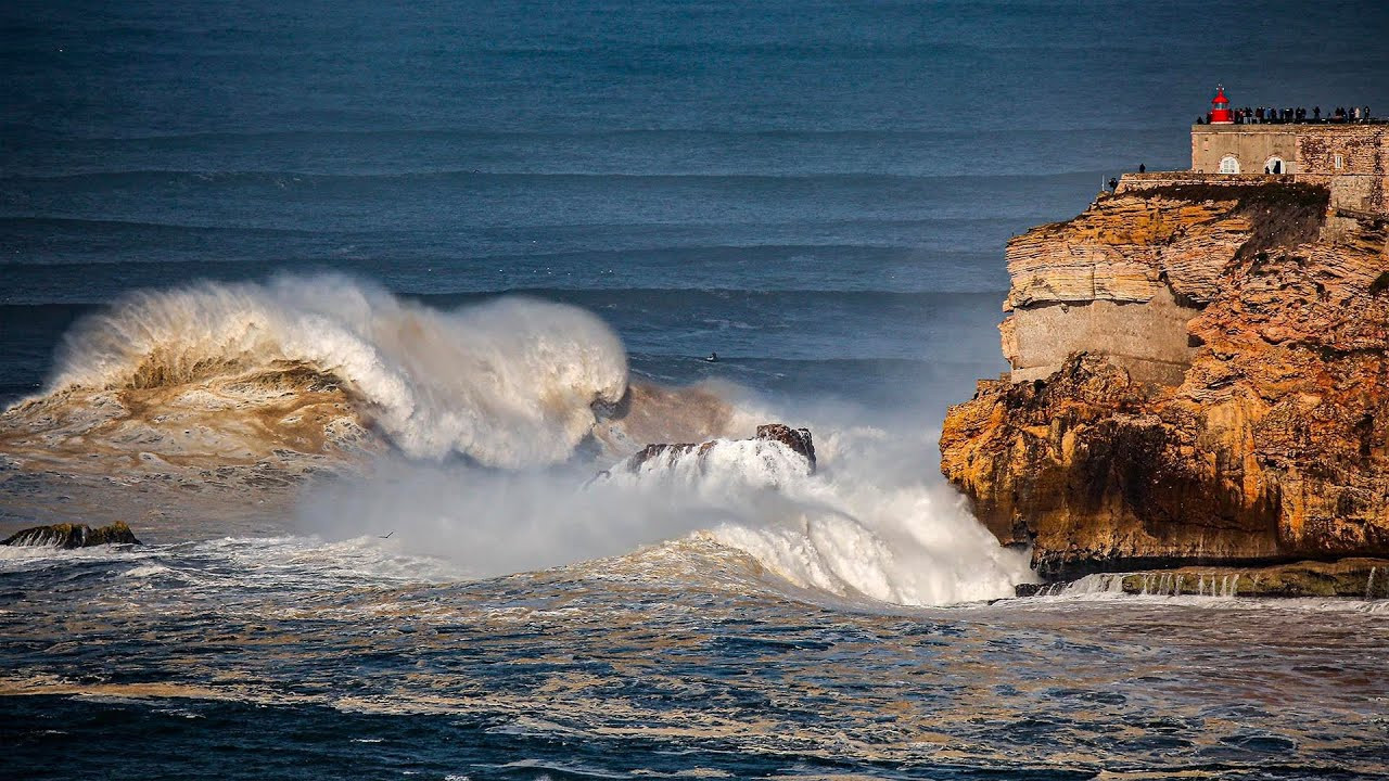 Watch Mason Barnes taking on a massive left-hand wave at Praia do Norte in Nazaré, Portugal.<br /><br />The surfer from Wilmington, North Carolina, rode this giant wall of water on February 25, 2022, after a huge North Atlantic swell hit the Portuguese coastline.<br /><br />Barnes was towed into this big wave by Pierre Caley.<br /><br />"It's the biggest wave of all time," and "It surely is the first 100-foot wave ever ridden" are some of the thoughts shared after his viral clip descending the liquid mountains hit the internet.<br /><br />"It was the biggest left of my life. It was a dangerous, scary day, but we made it happen. I have to thank Pierre and Clément for the tow and safety," expressed Barnes.<br /><br />"Nazaré is making my dreams come true. A lot of work went into finding this wave. Finding two guys to trust my life with, a spotter, two jet skis, two sleds, two ropes, and three radios took days of reaching out to everyone I know."<br /><br />"These waves take a team, and I'm forever grateful to have the right people in my corner. So next time, I'm pulling in!"<br /><br />Full Story:<br />https://www.surfertoday.com/surfing/has-mason-barnes-surfed-the-100-foot-wave-at-praia-do-norte<br /><br />Online Surf Shop<br />🏄🏻‍♂️ https://bit.ly/online-surf-shop