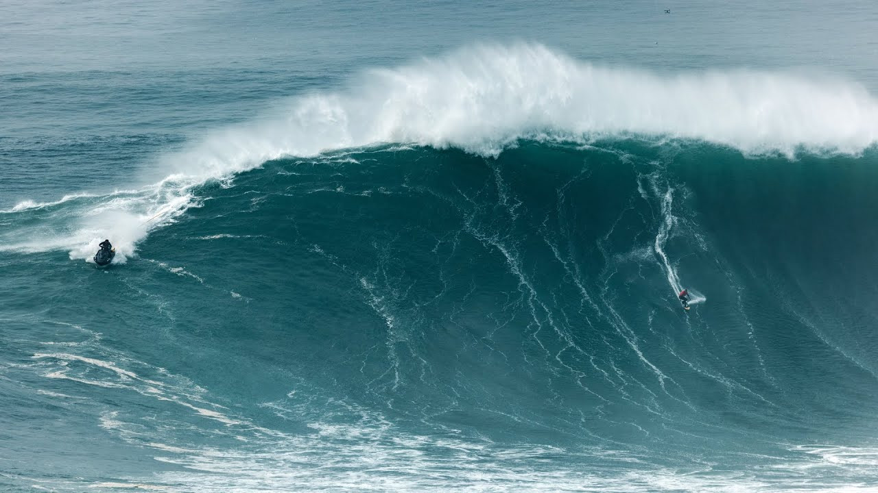 The World Surf League (WSL) 2022 Nazaré Tow Surfing Challenge took place today at Praia do Norte, Nazaré, Portugal and the world's best big wave surfers reveled in the clean, 40-to-50-foot waves on offer.<br /><br />It was no surprise that Lucas ‘Chumbo' Chianca (BRA) burst out of the gates from the first heat, and despite not surfing with his usual teammate, Chianca and Nic von Rupp (PRT) were an incredible team.<br /><br />Chianca scored his best wave early on, speeding down the line with a critical turn in the lip and riding it out for an 8.33 (out of a possible 10). Both surfers increased their scores in their second heat and Chianca was pushing the limit of what was previously thought possible on big waves when he launched into a mind-bending alley-oop on one of his waves.<br /><br />"We're super stoked, we have a special connection out there. We are always looking for the same waves and that's why I think we are the perfect match!" said Chianca. <br /><br />"It's a really great opportunity, I've always looked up to Chumbo," said Von Rupp.<br /><br />"He is the guy that always pushes your limits and his own limits so it's a pleasure to compete with him."<br /><br />Nazaré standout Justine Dupont (FRA) suffered an unfortunate fate on her first wave, getting caught by the white water and injuring her left ankle when her foot got stuck in the strap of her board.<br /><br />Dupont was unable to continue surfing her heat, bringing an early end to her and team partner Tony Laureano's (PRT) run at Nazaré.<br /><br />Michelle des Bouillons (BRA) put up an impressive performance, pushing herself into some big bombs with her compatriot and partner Ian Cosenza (BRA).<br /><br />Des Bouillons put in a lot of time to improve at Nazaré and it showed, with better positioning taking off deeper and committing to huge rides.<br /><br />Lucas Chianca (BRA) once again retained the Men's Best Performance and the Best Team Performance titles, this time partnering with Nic von Rupp (PRT).<br /><br />"I was happy with my waves, and I can't wait to learn more and try to improve with my surfing. I'm super stoked to win the best performance and best team with Nic. We had that connection in the water, that was the best part. I didn't have to say anything, he was choosing the waves for me and I just performed and he did the same so it was the best," said Chianca.<br /><br />"Teaming up with Chumbo was amazing, he's such a positive guy, has so much energy. He's an amazing surfer, he's so kind and he's sharing his world so it was amazing to be out there. We got a bunch of waves and he was cheering for me and he got a bunch of good ones as well, so yeah stoked!" said Von Rupp.<br /><br />It was a close battle for the Women's Best Performance award between Des Bouillons and Maya Gabeira (BRA), but patience and experience paid off for Gabeira who clinched the top spot in the last heat of the day. <br /><br />"It's been a rollercoaster!" said Gabeira.<br /><br />"It's been a really hard day, we got pounded at the beginning of our first heat and I used all of my canisters and had a bad sensation on my spine. I kept surfing but I was just a little bit overwhelmed with stress. Seeing Justine get injured just before my heat, then Antonio (Silva), and now Jamie (Mitchell), there was just a difficult vibe today. I'm really glad I had Pierre (Rollet) on the ski with me today, he killed it and we made it in one piece. It's my first professional win and here in Nazaré where I've dedicated most of my life now."<br /><br />First-time tow partners Rafael Tapia (CHI) and Jamie Mitchell (AUS) delivered some solid performances, but it was Mitchell's commitment and athleticism that saw him in the perfect spot on every wave, and his ability to read the waves and combine different maneuvers together was the point of difference and awarded him the Most Committed Award.<br /><br />Pushing himself in the final moments of the day's last heat to find a score and take the lead, Mitchell pulled into a massive backside barrel on the infamous lefts of Nazaré and unfortunately suffered a violent wipeout.<br /><br />Suffering a back injury, Mitchell was evaluated and treated by the medical team on-site and evacuated quickly to further assess his condition. He is currently being treated at a local hospital.
