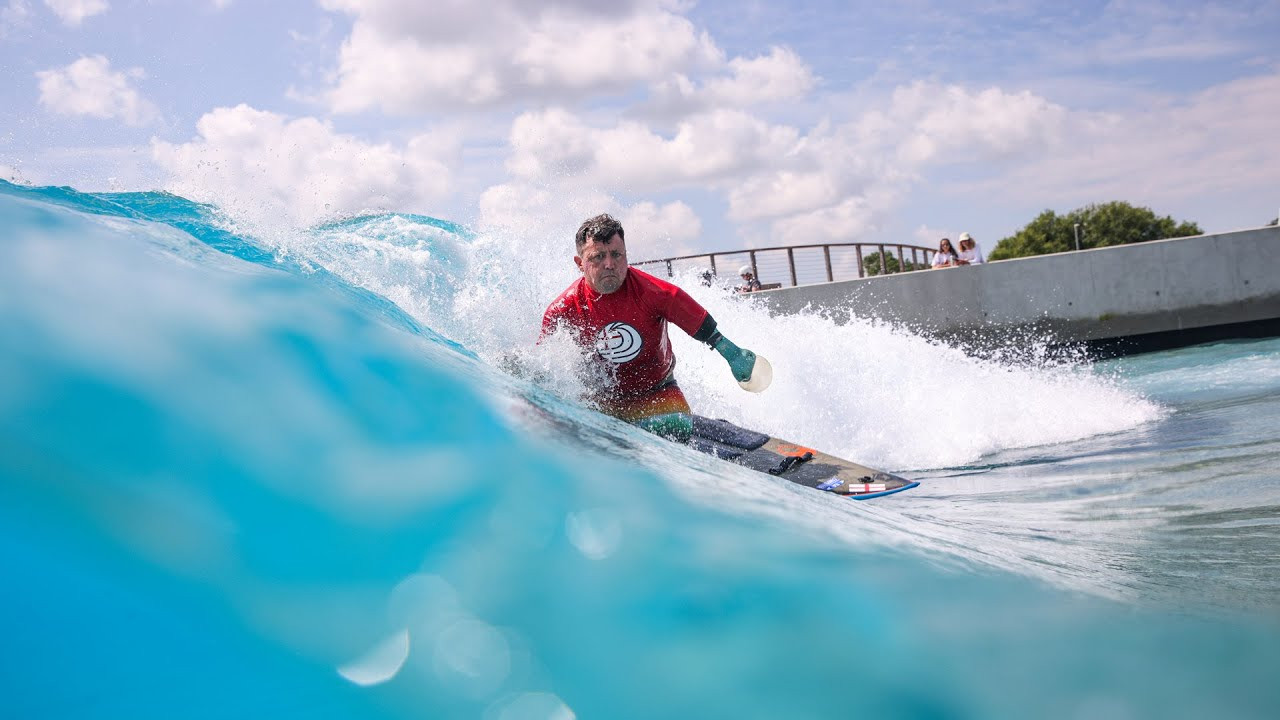 Sunshine and waves were on tap at the concrete shores of The Wave, Bristol, for the 2021 English Adaptive Surfing Open.<br /><br />It was an incredible day for all and the champions of the contest have been crowned.<br /><br />Surfing England also welcomed 14 new adaptive surfers into the community after the launch of a Waikiki wave participation session.<br /><br />The governing body's ambitions are to see adaptive surfing become a Paralympic sport and events such as this drive this movement one step closer.<br /><br />The atmosphere was full of anticipation and excitement ahead of the start of the contest heats.<br /><br />The surfers came together, and friendly rivalries were reignited as the wave machine came to life and the first waves rolled through.<br /><br />Heats lasted for 6 sets of waves, all rides scored, and the top wave from the left and right side combined to give final positioning at the end of the contest. <br /><br />Setting the day off, the Assisted Division sparked the interest of the crowds.<br /><br />Mark Hagger, competing with Surfing England for the first time excelled with a wave score of 7.17, and he took the champion title.<br /><br />Battling for the other top spots and in very close scores were Jay Friedlander, Mark Bowra, and Tash Davies. <br /><br />In the standing crisp turns were completed, riding in the pocket, and many charging to get into those cheeky barrel sections that pop up on the advanced wave.<br /><br />Israeli surfers Nachman Balulu and Adi Klang added an international flavor to this division and put some impressive surfing and scores on the table, alongside our home English and Welsh surfers. <br /><br />A standout moment, Llywelyn "Sponge" Williams set the sitting/kneel division off with a banging 360 on the wave.<br /><br />A regular at The Wave, Martin Pollock’s training clearly showed as he chased Sponge very closely on the heat on the left. <br /><br />The Men’s and Women’s Open Divisions are a real highlight and unique aspect of our English event.<br /><br />These heats see competitors come together for an all-out battle to claim champion spots from cross divisions.<br /><br />These heats are always serious crowd-pleasers and are epic to watch, whilst scores drop live as the judges decipher exactly what the board and riders are doing to maximize points. <br /><br />It was great to see Go Pro supporting the contest with an award for the Hero Moment, awarded to David Lewis, a Visually Impaired athlete with a belter of a wave that he rode all the way to the bay. <br /><br />A key part of driving forward adaptive surfing in England is opening up the participation pathways.<br /><br />Surfing England actively made a move to address this with the introduction of a Waikiki participation session and welcomed 14 surfers to The Wave, for many their first-time surfing.<br /><br />The progression from some of the new surfers within the hour session was phenomenal - riding waves all the way into the bay.<br /><br />Those with experience were straight to it cruising on the glassy lake waves - the pier and lake were alive with everyone hollering encouragement and the raw emotion as surfing yet again is in action transforming people’s lives. <br /><br />Mark Bowra from The Bowra Foundation went above and beyond to support this Waikiki session with two awards for Most Determined Surfer (one on each side of the lake).<br /><br />Congratulations to Ayla Halewood and Danny Teare who won these and scored themselves a voucher for another surf at The Wave. <br /><br />Catching up with Nick Hounsfield, Founder of The Wave and Chair of Surfing England, Nick says "Yesterday was the 'Day of Days'! After a rollercoaster year, it was incredible to see friends, athletes, volunteers, partners, and sponsors all come together to create an event that epitomizes 'why we do, what we do.' Seeing the athletes step up another level from last year, combined with hosting the Waikiki taster session to help grow the sport, was the perfect combination of performance and purpose. The future for adaptive surfing as a sport is incredibly bright and there is a real groundswell of support behind building our healthy surfing community!"<br /><br />During the event, Nick jumped in the water to support the delivery of the Waikiki session, alongside Ben Powis, CEO, of Surfing England who states "The English adaptive surfing movement is gaining real momentum. We have some of the best athletes in the world, amazing support crew, and events like this to showcase the sport and to feed into the work happening internationally to see adaptive surfing recognized as Paralympic sport."<br /><br />An absolute standout mention to all the volunteers who attended and make events such as this possible.<br /><br />2021 English Adaptive Surfing Open | Results<br /><br />Men's Open<br />1. Adi Klang<br />2. Llywelyn ‘Sponge’ Williams<br />3. Pegleg Bennett<br />4. Martin Pollock<br /><br />Women’s Open<br />1. Charlotte Banfield<br />2. Natasha Davies<br />3. Juliette Friedlander<br />4. Katie Richards<br /><br />Assisted<br />1. Mark Hagger<br />2. Juliette Friedlander<br />3. Mark Bowra<br />4. Natasha Davies<br /><br />Sitting/Kneeling<br />1. Llywelyn "Sponge" Williams<br />2. Martin Pollock<br />3. Isaac Heaher<br /><br />Standing<br />1. Adi Klang<br />2. Nachman Yariv Balaulu<br />3. Pegleg Bennett<br />4. Louis Sutton