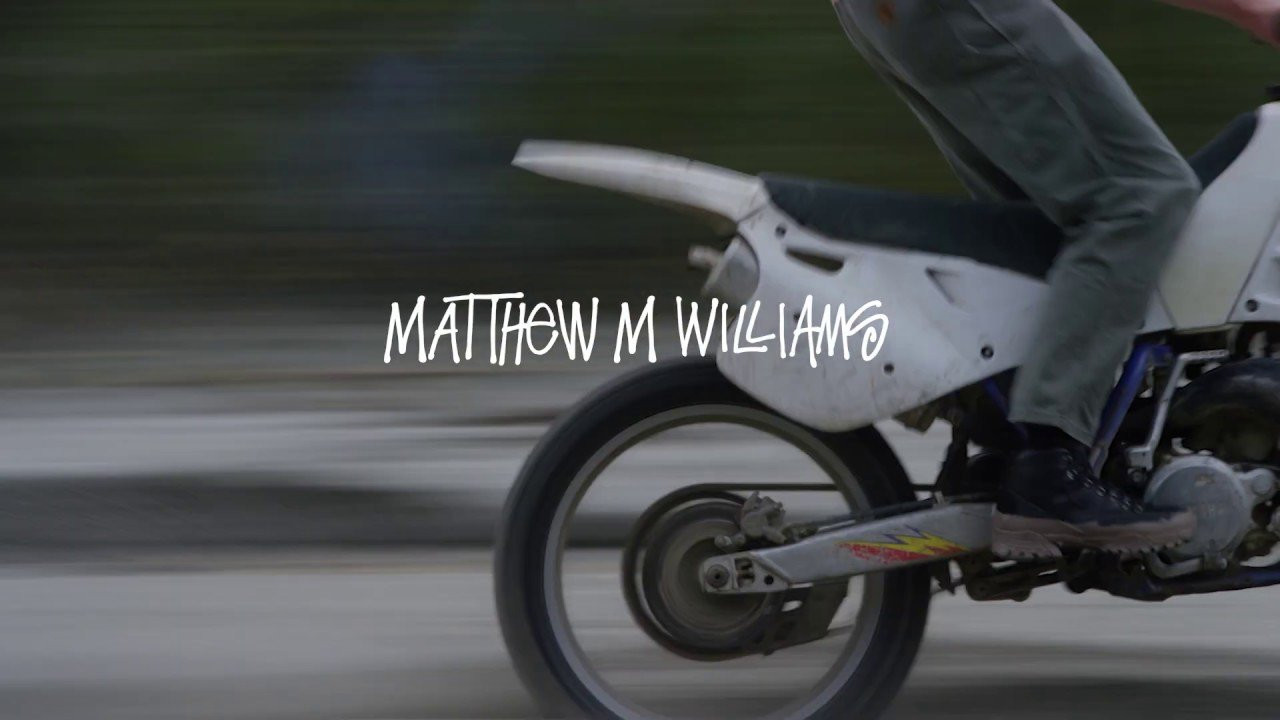 Matthew M. Williams is the Creative Director of 1017 ALYX 9SM, a brand founded in 2015 and built on fusing subcultural influences with utilitarian experimentation. He brings this same unique perspective to a new collaboration with Stüssy through two distinctive products. There’s both a vibrant, garment dyed tee made of recycled organic cotton, marked with rudimentary archival Stüssy graphics, as well as a co-branded leather hiking boot from Italian footwear brand Roa, sporting an atypical hand-applied, artificially-muddied treatment.<br /><br />Stüssy / Matthew M. Williams will be available in North America Chapters &<br />Stussy.com on October 18th, 2019, and globally on October 25th, 2019.<br /><br />Photo: Liam MacRae @liammacrae<br />Video: Hayden Rensch @dronepilot22