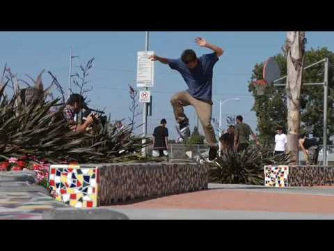 Justin puts a hurting on a mosaic-tiled bench.