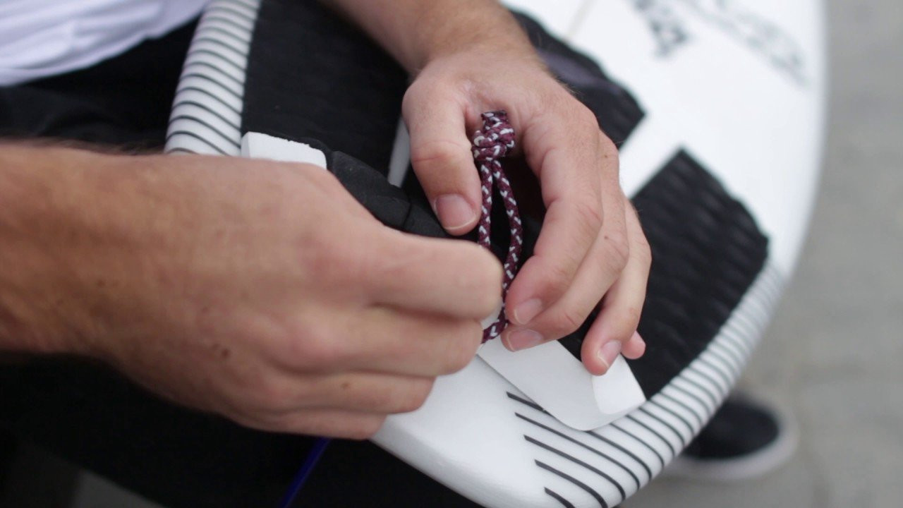 Can't get that leash string in your new board? Use a fin key or your car key to gently ease the string through the metal loop. Comment below with any other everyday surf hacks or tips of your own. <br /><br /> Learn more at http://hurley.com/surfclub