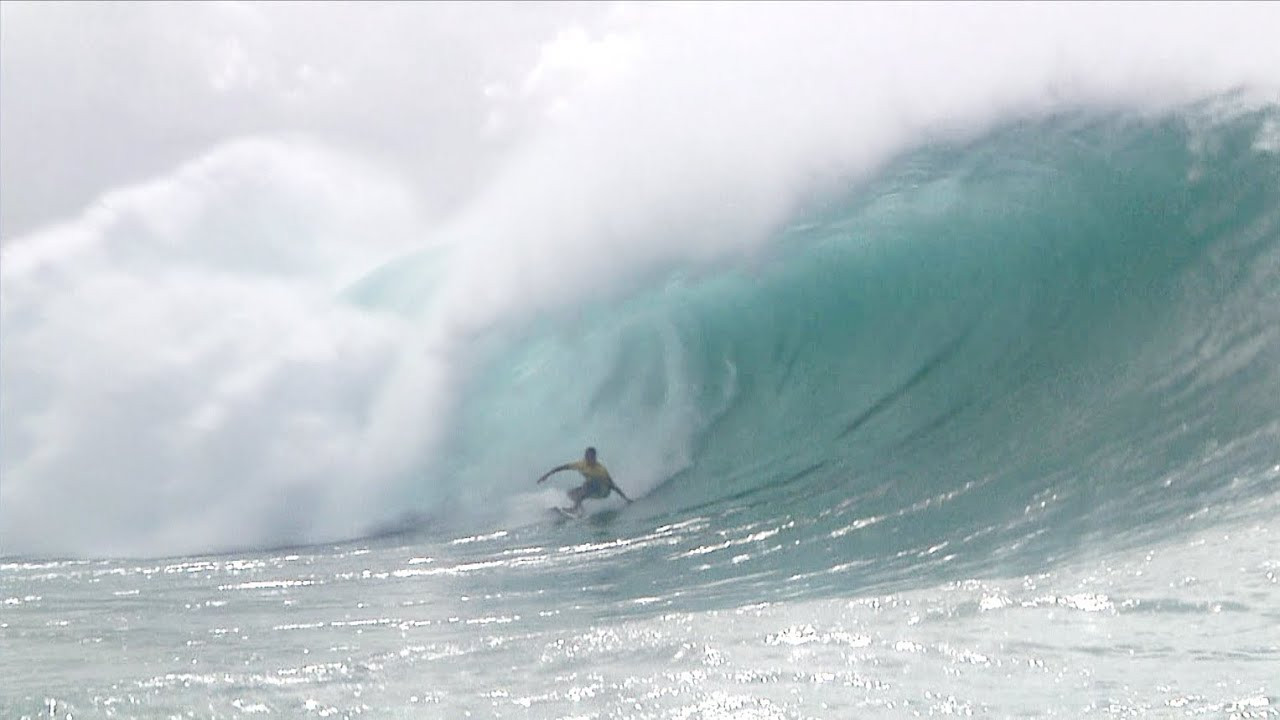 http://www.volcom.com/boardies<br /> <br /> Volcom team surfer Carlos Muñoz pulls in and out of a massive 10-point barrel during the 2012 Volcom Pipe Pro while wearing the V4S Stripe Boardshort