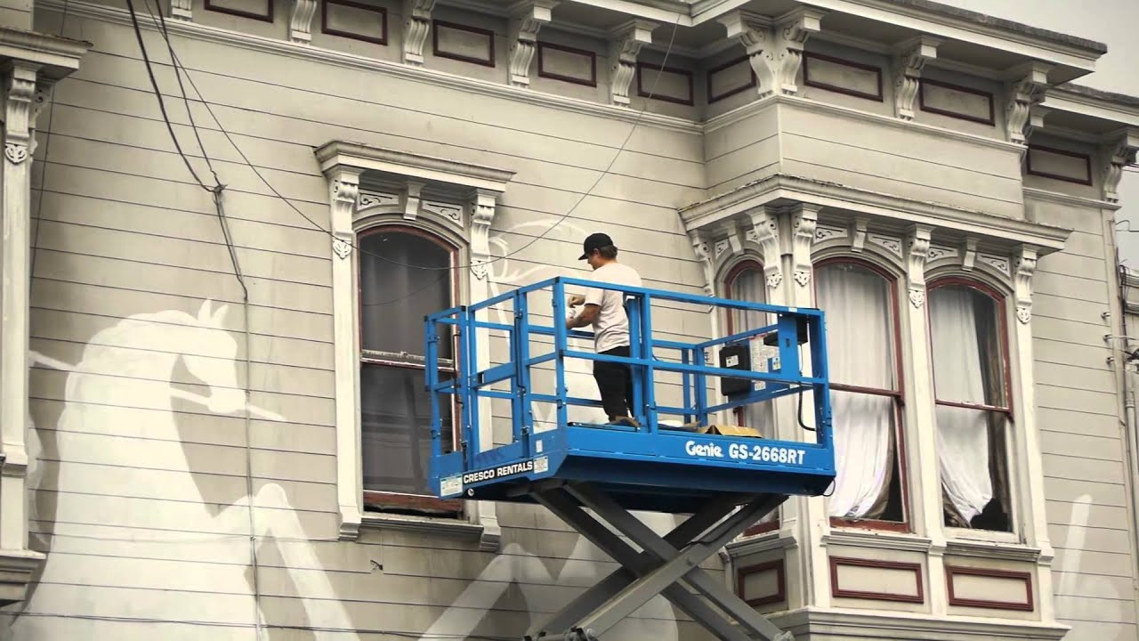 Andrew Schoultz took over a whole city block on the corner of 24th and York in the heart of the mission and turned a previously whitewashed building crazy shades of blue and red.