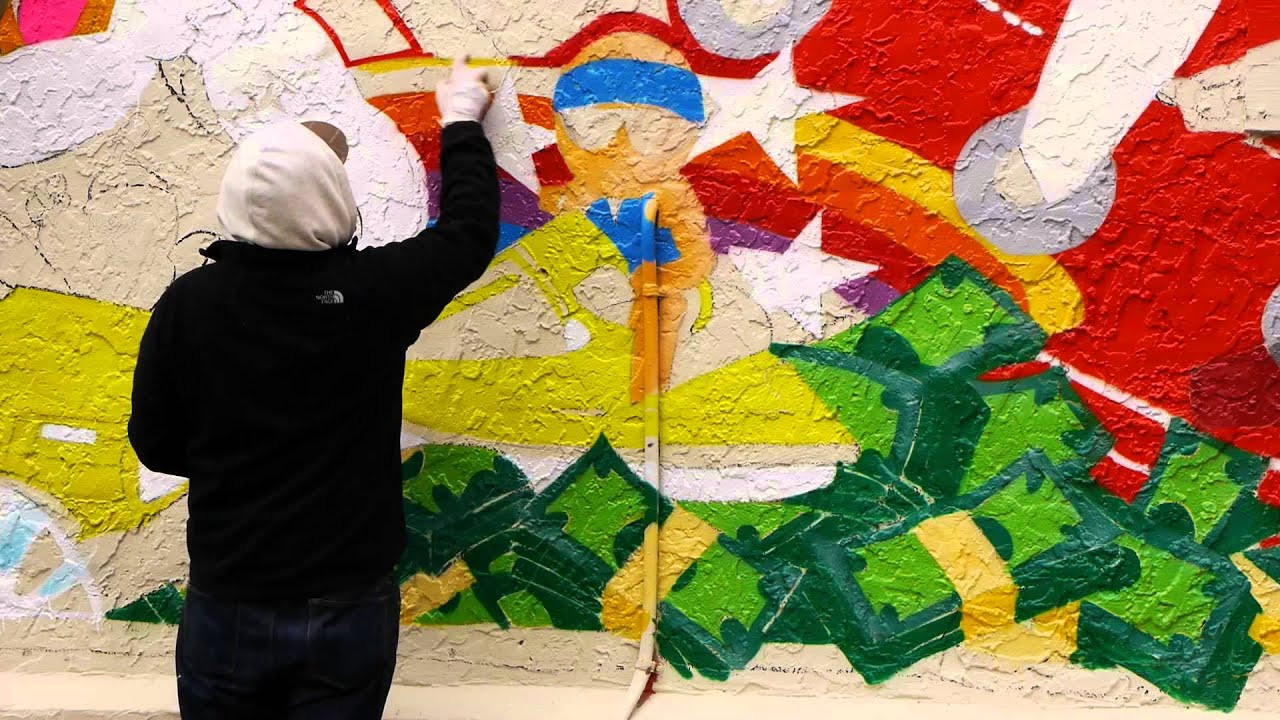 Grafitti Artist and Muralist Sever is a staple of the Atlanta artistic community -- whose works can be seen all over the world, and most famously in his hometown. His bold lettering and palette are a staple in downtown in Atlanta, and as part of the Wall to Wall series, he contributed a piece on the corner of Euclid and Colquitt in Little Five points that needs to be seen to be believed.<br /><br />For more on the Wall to Wall series:<br />http://www.Converse.com/Wall to Wall<br /><br />For more on Sever:<br />http://www.toprotectandsever.com