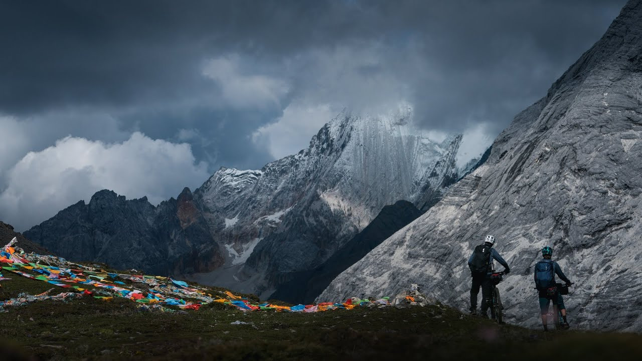 High in the Himalayan hinterlands of southwest China, three majestic mountains soar above sprawling floodplains that spill into the country's sweltering lowlands. Over the centuries, various Dalai Lamas have ordained these towering peaks as sacred, and the Tibetan people who inhabit this isolated region revere them as granite gods. A pilgrimage around the base of these 19,000-foot-high giants is considered a holy undertaking, and those lucky enough to finish this arduous circuit—known as the 'Yading Kora'—hope the effort will purify a lifetime of negative karma. Inspired by this time-honored rite of passage, three adventurers set out to complete this kora on mountain bikes, carrying everything they need to survive the 10-day mission themselves.