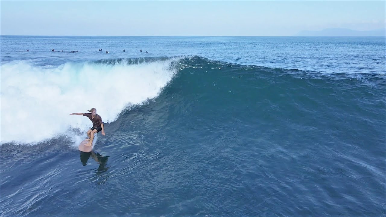 This perfect A-Frame in Sumbawa picks up loads of swell, so even on the smaller days it's usually shoulder to head high and always super rippable. There was a little bump on the face a few days ago, but it still looked loads of fun out there.<br /><br />If you would like to support us, please buy us a coffee here: https://www.buymeacoffee.com/infowy<br /><br />If you like the content, please subscribe to the channel here: http://bit.ly/2NPrV5H<br />_____________________________<br /><br />OUR AMAZON STORE: https://www.amazon.com/shop/globalzoo-surfingvideos?ref=ac_inf_tb_vh <br /><br />IF YOU WANT TO CREATE SURF VIDEOS LIKE THIS CHECK OUT THE GEAR WE USE FROM AMAZON: <br /><br />Our camera: https://amzn.to/3XHjiMe <br />Our drone: https://amzn.to/3HauKJg <br />Our main lens: https://amzn.to/3Jo9qCU <br />Our other lens: https://amzn.to/3Ji9XWW <br />Our main tripod: https://amzn.to/3Y6yUZG <br />Our second tripod: https://amzn.to/3Hh9EsJ <br />Our second tripod head: https://amzn.to/3WPpsbQ <br />Our camera bag: https://amzn.to/3HdvTzH <br />The laptop we edit on: https://amzn.to/3Hdwb9L <br />Our external hard drive: https://amzn.to/3Y2lJc0 <br /><br />_____________________________<br /><br />Social media accounts:<br />Instagram: https://www.instagram.com/global.zoo.co/?hl=en<br />Facebook: https://www.facebook.com/Global.Zoo.Co<br /><br />_____________________________<br /><br />DISCLAIMER <br />Some of the links above are affiliate links, where I earn a small commission if you click on the link and purchase an item. You are not obligated to do so, but it does help fund these videos in hopes of bringing value to you! <br /><br />#SurfingSumbawa #SurfingIndonesia #Sumbawa #LakeyPeak #Sumbawa2021 #SurfingBali #SurfingBali #Bali2021 #AlwaysLef #Surf #Waves