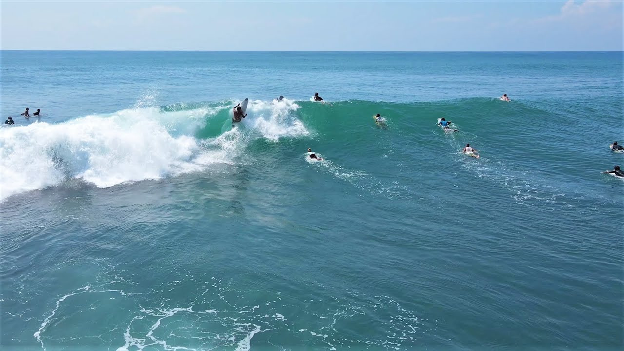 Uluwatu started working for the first time in months as the relentless Westerly winds took a break a couple of days ago. This is a bit of a special occasion during the wet season, so inevitably a big crowd descended on the world famous left. Check out the wave at 0:30 for a pretty close call as the surfer navigates through the hectic line up! <br /><br />It was far from perfect out there, and the wind started blowing side shore later on in the session making for bumpy and tricky conditions. Nevertheless, everyone was definitely stoked to be scoring the West coast at this time of year.<br /><br />If you would like to support us, please buy us a coffee here: https://www.buymeacoffee.com/infowy<br /><br />If you like the content, please subscribe to the channel here: http://bit.ly/2NPrV5H<br />_____________________________<br /><br />OUR AMAZON STORE: https://www.amazon.com/shop/globalzoo-surfingvideos?ref=ac_inf_tb_vh <br /><br />IF YOU WANT TO CREATE SURF VIDEOS LIKE THIS CHECK OUT THE GEAR WE USE FROM AMAZON: <br /><br />Our camera: https://amzn.to/3XHjiMe <br />Our drone: https://amzn.to/3HauKJg <br />Our main lens: https://amzn.to/3Jo9qCU <br />Our other lens: https://amzn.to/3Ji9XWW <br />Our main tripod: https://amzn.to/3Y6yUZG <br />Our second tripod: https://amzn.to/3Hh9EsJ <br />Our second tripod head: https://amzn.to/3WPpsbQ <br />Our camera bag: https://amzn.to/3HdvTzH <br />The laptop we edit on: https://amzn.to/3Hdwb9L <br />Our external hard drive: https://amzn.to/3Y2lJc0 <br /><br />_____________________________<br /><br />Social media accounts:<br />Instagram: https://www.instagram.com/global.zoo.co/?hl=en<br />Facebook: https://www.facebook.com/Global.Zoo.Co<br /><br />_____________________________<br /><br />DISCLAIMER <br />Some of the links above are affiliate links, where I earn a small commission if you click on the link and purchase an item. You are not obligated to do so, but it does help fund these videos in hopes of bringing value to you! <br /><br />#SurfingBali #SurfingIndonesia #Bali #Uluwatu #Bali2021 #AlwaysLeft #Surf #Waves #surfersofbali