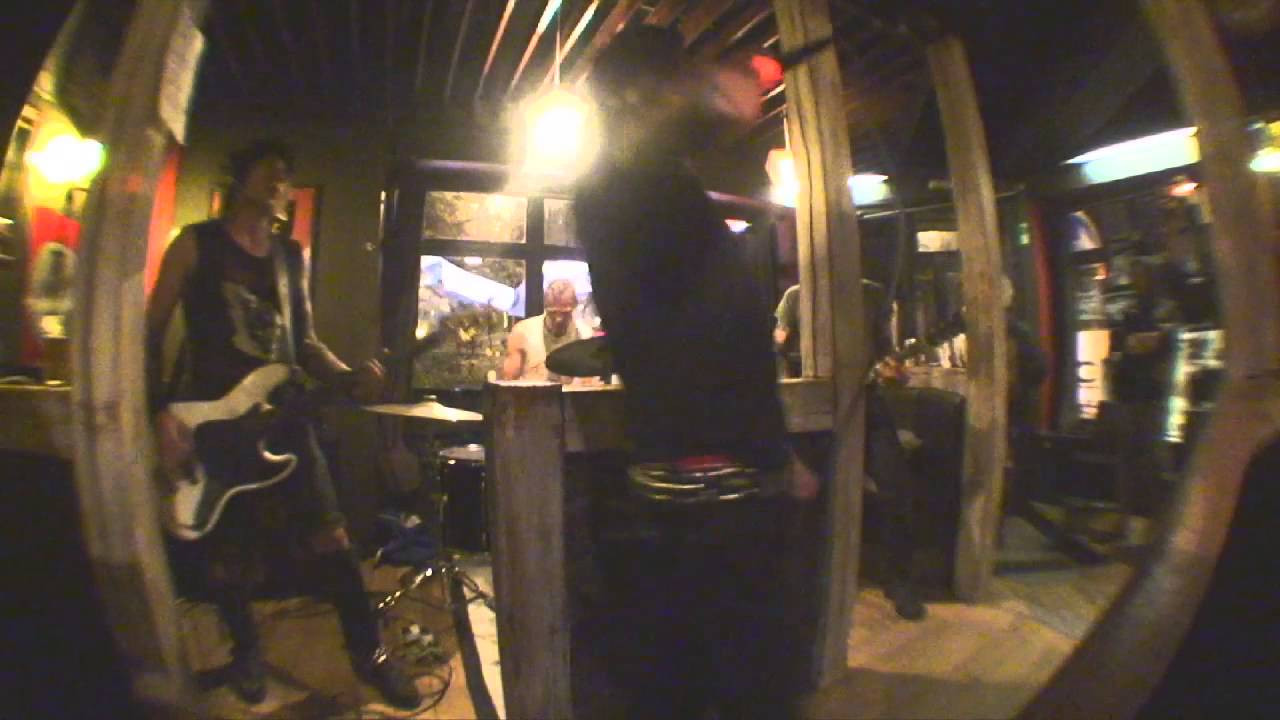 Last year on 9/11 I took the train to Liege, Belgium, the closest place ILEGAL were playing on their seven week tour across Europe. Forming in Montreal, Canada, all the members of the band were immigrants, except for the bassist. Locio, the singer, is from Mexico. Johnne, the drummer is from Finland. Simon, the guitarist is from England/USA. I've tried twice to do an interview with Ilegal, the first time the tape player was broken. The second time we went out drinking after the show and the interview never happened. At this point, none of them live in Montreal, but they also don't live in the same city, but they will be back, to record another album and possibly another tour in the future. On their tour around Europe from Finland, to Italy, Greece, Spain, Basque country, France, Belgium and Germany they usually had about 50-300 people in attendance, but the one show I checked out had the least about of people in the audience, about 10 people, including the bartenders and the roadie. My video camera records shitty audio when blasted out next to the speakers, so if you like the style of Ilegal, you should check them out online or buy their album at an underground record distro. - J. Hay<br /><br />http://www.confuzine.com/2013/05/08/ilegal-live-in-liege-belgium-911/