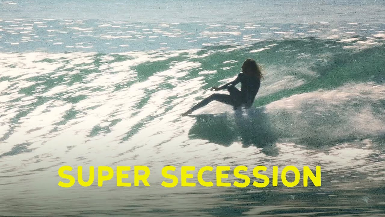 Sometimes the most radical thing a citizen can do is go surfing. One day, in early 2025, Alex Knost, Karina Rozunko, Nick Melanson, Justin Adams, and Sarah Tanooki showed up at the same point break, grabbed their boards, put their wetsuits on, paddled out, and went surfing. <br />Super Secession is a short film by Matthew Allen<br />Music is "Eyes Closed" by Seventies Tube Ride