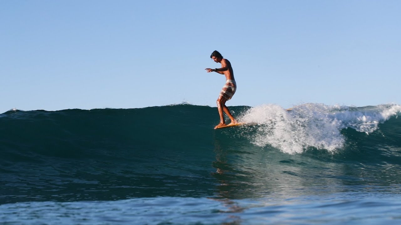 Watch a short clip of the relationship of a shaper (Craig Kawamura) and a surfer (Bronson Sterling) unfold on a glorious morning on the south side of Oahu, Hawaii. Bronson is on a GURU model. The dimensions are 9'-7 1/2" x 23" x 3 1/16"<br /><br />More information - https://lostnotfound.com/collections/guru