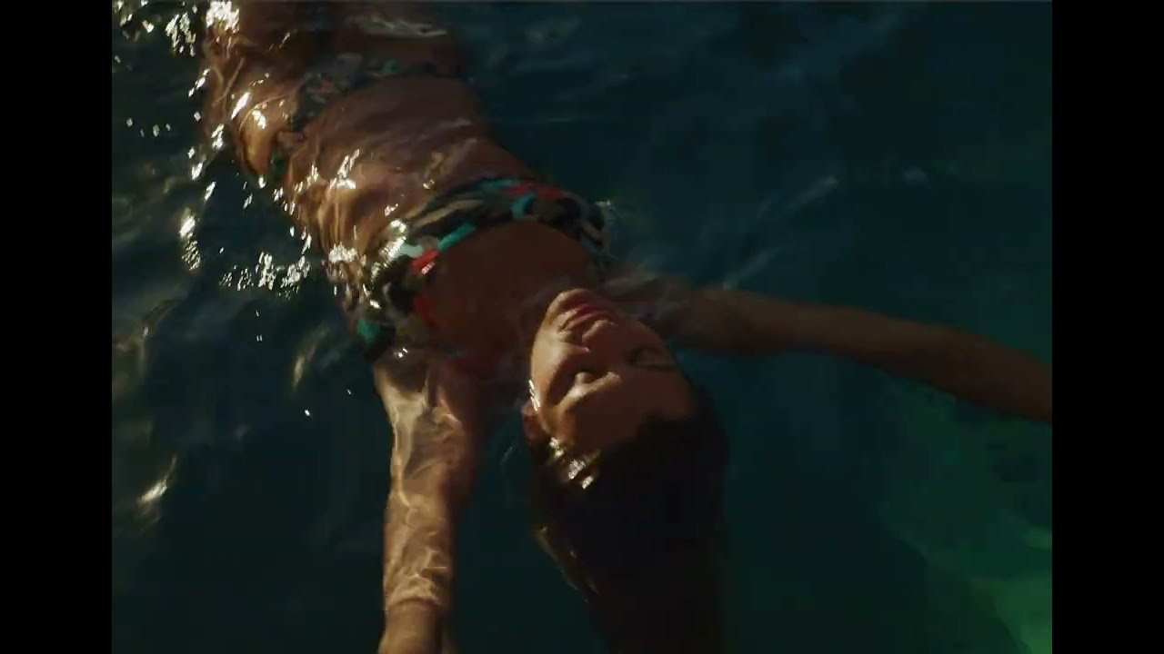 Dark, dreamy, and undeniably bold—Hamoa is a tropical statement. Lush red and light blue florals bloom alongside layered green leaves, creating a striking contrast against a deep black background. Ribbed fabric adds texture and depth, making this design as captivating as it is effortless.