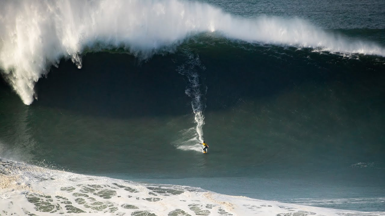 Brazilian Lucas Chianca and France's Justine Dupont both claimed victory in the world's most prestigious big-wave surfing contest, the Nazaré Big Wave Challenge 2025, amid some of the biggest waves the contest at Praia do Norte in Nazaré, Portugal, has ever seen.<br /><br />The 2025-26 edition of the tow-surfing event was called on for Saturday, December 14, as a huge Atlantic swell pushed some of the biggest waves ever seen at the tow-surfing competition into Praia do Norte, with faces ranging from 40-50 feet (12-15 meters) that required huge commitment and perfect synchronization from competitors and their safety crews.<br /><br />Multi-time Nazaré Big Wave Challenge winner Lucas "Chumbo" Chianca delivered an incredibly committed performance, riding two of the biggest waves of the day while also enduring two of the biggest wipeouts.<br /><br />After going over the falls on his first wave and being held underwater for almost 30 seconds, Chianca regrouped and was soon back up on another wave, but went over the falls again and had to endure another wipeout.<br /><br />His tow partner Pedro "Scooby" Vianna plucked him out, and Chianca went back out to eventually score his fifth Best Male Performance award.<br /><br />After the first heat, Chianca sat in the lead with a score of 23.60 to the 23.46 of Portuguese local Nic von Rupp.<br /><br />The second round competition was ultimately called off early following a power outage on the headland, so Chianca narrowly beat von Rupp to the title by 0.14 points.<br /><br />Rupp, however, scored the best wave of the day, an 8.33-scored ride, and the Best Team Performance alongside partner Clement Roseyro.<br /><br />"That was a heavy moment for sure, one of the heaviest wipeouts of my life. I want to thank Sebastian Steudtner for picking me up right in front of the rocks; he saved my life today."<br /><br />"The day started really gnarly, but we tried our best. Pedro 'Scooby' Vianna put me on some bombs, and I put him on some bombs. Thanks to Nazaré for putting on a show and to WSL for making this happen," said 30-year-old Chianca.<br /><br />Backing up her win from the 2024/2025 edition in February, Justine Dupont earned her second-consecutive Best Women's Performance award and her fifth overall victory in the event.<br /><br />Now based in Nazaré with her family, the French big-wave specialist rode the giant waves with style, successfully riding out onto the shoulder.<br /><br />Dupont's two best waves were a 6.9 (doubled) and a 6.07, which saw her score a 19.87-point total to take the win from Brazil’s Michelle des Bouillons (17.5) and Great Britain’s Laura Crane (11.93).<br /><br />"It was a crazy day, and I'm so happy with the win. I just want to thank Eric Rebiere, he's the best driver out there," said Dupont.