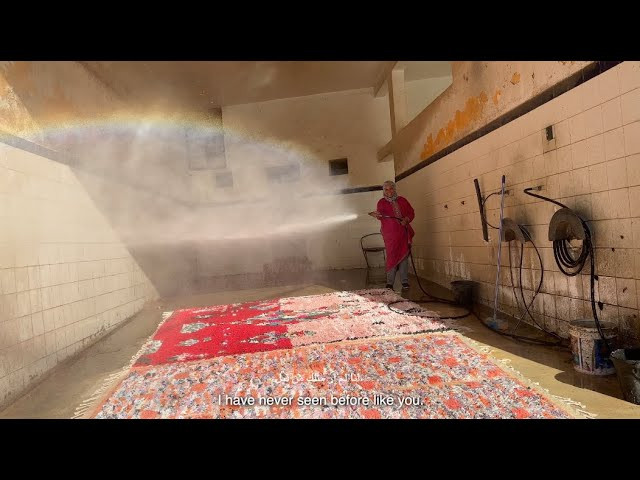 Directed by Mitch Ryan<br /><br />AP x Stussy Boucherouite Second Carpet Collection:<br /><br />Artisan Project, is a collective of passionate individuals led by Palestinian-American textile designer Nina Mohammad. For more than 12 years she has been the visionary creative director behind Artisan Project and has dedicated over a decade to unearthing, nurturing, and uniting skilled artisans, makers, and creatives from diverse backgrounds. Guided by core values of honesty, fairness, and transparency, Nina's work goes beyond mere collaboration—it's a celebration of cultures, talents, and shared dreams.<br /><br />Since its formation in 1977, the Ain Leuh Women's Cooperative has woven together generations of expertise, sustaining its artistry through minimal support and exposure. The intricate craft of weaving is more than a skill; it's a thread that binds the community, connecting farmers, herdsmen, yarn makers, and families. The cooperative's members, spanning various ages and abilities, have seamlessly integrated weaving into their daily lives, ensuring not just their livelihoods but also the preservation of ancient cultural practices.<br /><br />At the heart of this collaboration lies a compelling narrative that bridges the past and present. The project involves transforming pre-cut t-shirts provided by Stussy, into captivating carpets that are a testament to ingenuity and resourcefulness. Nina, as the creative director, meticulously curates the artistic direction, drawing inspiration from ancestral carpets, art, vintage graphics, and the beauty of nature itself—capturing aerial landscapes, bodies of water, and the intricacies of flora. Her role doesn't end at ideation; she meticulously crafts color schemes and provides detailed guidance to the weavers at Ain Leuh, infusing each carpet with a distinctive essence that transcends time and tradition.<br /><br />"This collaboration is a true amalgamation of creativity, talent, and heritage," says Nina. "We're not just making carpets; we're weaving stories that honor the past while embracing the future and are breathing life into threads of history, creating connections that are as enduring as the art itself."<br /><br />As these remarkable carpets are unveiled, they stand as a testament to the remarkable partnership between Artisan Project and the Ain Leuh Women's Cooperative—a fusion of innovation and tradition, creativity, and craftsmanship.<br /><br />The weavers who worked on the AP x Stussy carpets:<br /><br />Khadijah El Abdi, President<br />Hachmia Douiri, Treasurer<br />Khadouj Ouashkek, Secretary<br />Fatima el Aroussi<br />Hjou Amraoui<br />Hay-at Assafi<br />Jamila Rachidi<br />Sadia Oubla<br />Rachida Ghanem<br />Mahamma Bahous