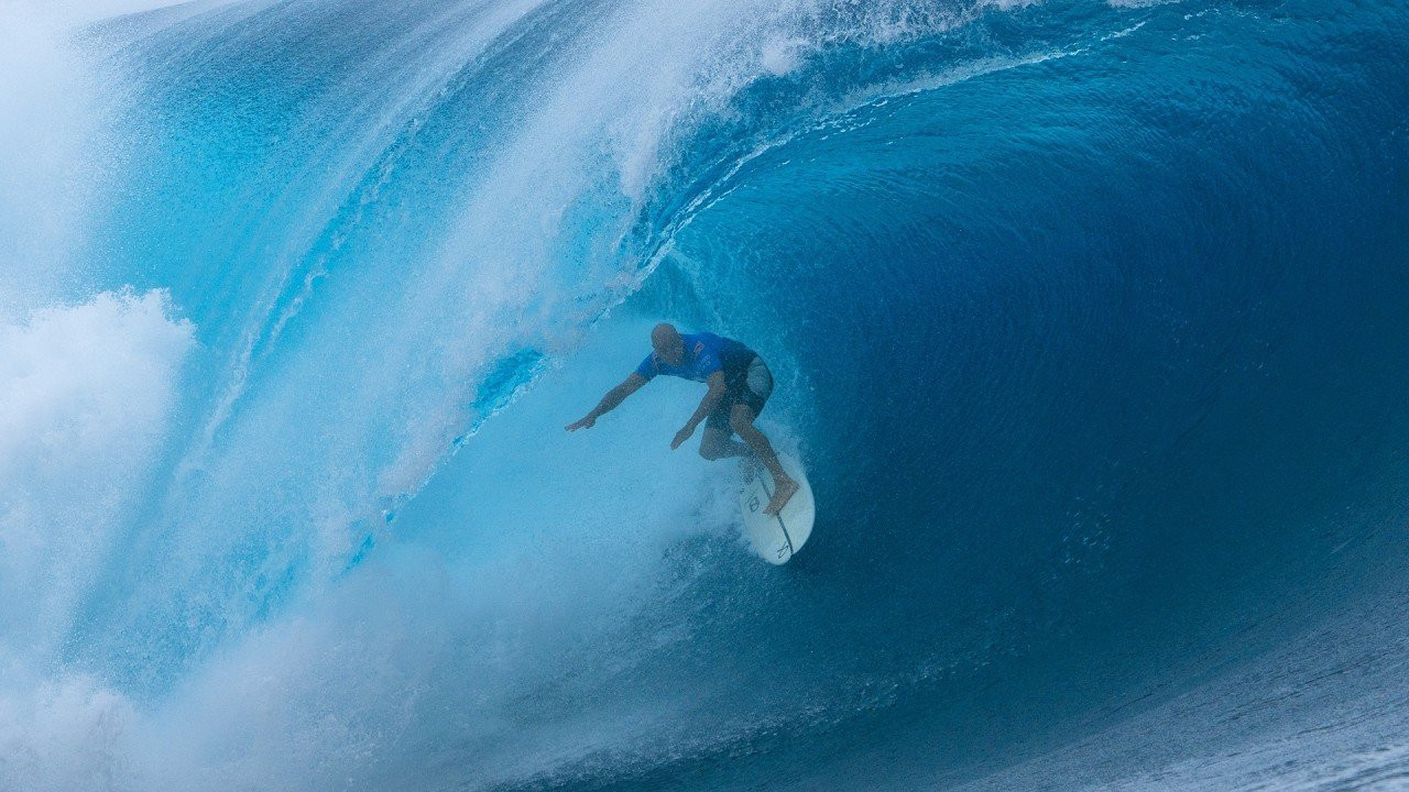 Five-time Tahiti Pro winner Kelly Slater proved that he’s lost nothing of the spark that has seen him as a contender in waves of consequence across nearly four decades.<br /><br />After opening with a late take-off straight into the barrel, the 54-year-old Event Wildcard built throughout his Round One heat against Eli Hanneman <br /><br />to post an excellent 16.23 (out of a possible 20) heat total, virtually on the mark of the 16.20 average Slater has been able to maintain across 20 appearances at Teahupo’o.<br /><br />Peaking with a 9.00 (out of a possible 10) ride that contained many trademarks of his unique style, including pumping deep in a backhand barrel with no hands on the rail, the 11-time World Champion kicked straight back into the competitive mindset that has set him apart from all others in the history of the sport.<br /><br />"It's sort of like riding a bike, but you forget how gnarly Teahupo'o is," Slater said.<br /><br />"You've got to just jump back on the horse out here. I won't say I started out slow, but I definitely built."<br /><br />"Each wave was kind of bigger and better until I maxed out on that 9, and then I had a no-hander after that that was pretty clean. I think I had four or five waves, and most of my scores were building until the end. I don't have anything to prove here, but when you put the vest on and paddle out, you need to feel like you have something to prove, especially in waves like this."<br /><br />"I also went out there trying to be relaxed and really in the moment. When you're not in the environment of competition all the time, it's not easy to stay in that mindset."<br /><br />"I felt like I kind of locked back in during that heat."<br /><br />Though Slater ended up taking a comfortable victory over Hanneman, it was through no lack of trying by the 23-year-old from Maui, who copped two of the day’s heaviest wipeouts.<br /><br />Slater’s path doesn’t get any easier from here, next facing two-time event winner Gabriel Medina, who will be hoping to maintain a track record that rivals the GOAT.<br /><br />The three-time World Champion, Medina, has appeared in the Final six times out of 10 showings in Tahiti and only placed worse than the Semifinals on two of those occasions, leading to a must-watch matchup.<br /><br />Footage: WSL